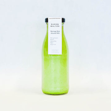 glass bottle of almond milk moringa milk drink 250ml