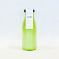glass bottle of almond milk moringa milk drink 250ml